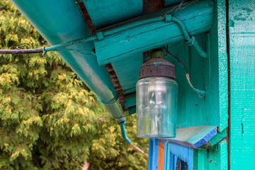 Fototapeta na wymiar old lantern under the roof of the house