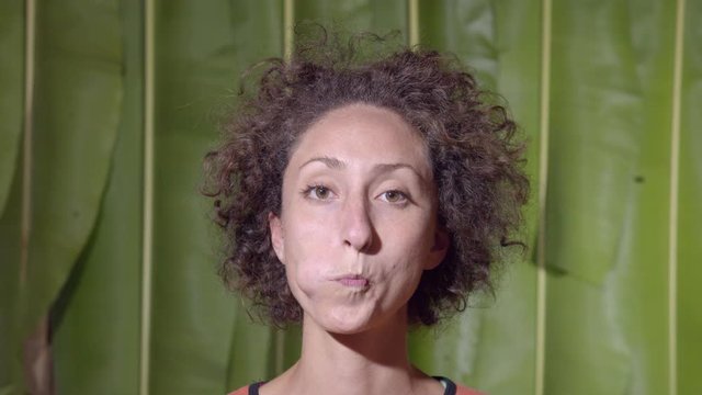 Woman Tongue In Cheeks Funny Facial Expression