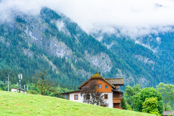 Fototapeta na wymiar Landscape with traditional house in Salzkammergut, an Austrian region of lakes and Alpine ranges near Salzburg, Austria