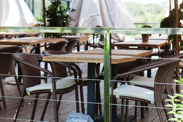 Table and chairs in park cafe. Modern design interior. Concept of vacation and leisure