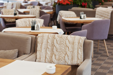 Table and chairs in park cafe. Modern design interior. Concept of vacation and leisure