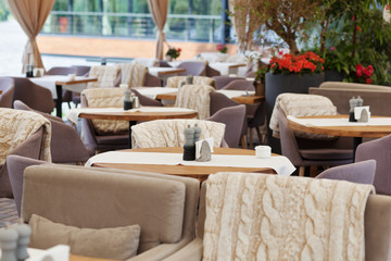Table and chairs in park cafe. Modern design interior. Concept of vacation and leisure