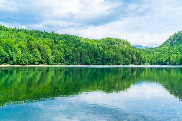 Obraz premium Nussensee lake in Upper Austria located near Bad Ischl in the Salzkammergut - wide panoramic view.