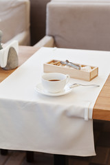 Cup coffee in park cafe. Modern design interior. Concept of vacation and leisure