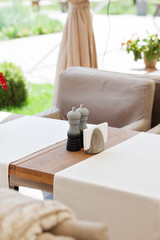 Table and chairs in park cafe. Modern design interior. Concept of vacation and leisure