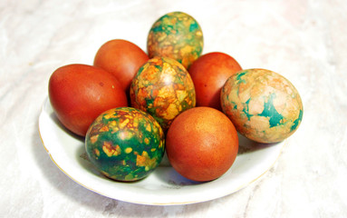 Colorful Easter Eggs On White Plate Placed By Heap