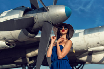 Brunette in a dress at the old airport
