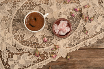 coffee and turkish delight on table decorated with dried rose flowers