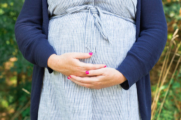 Close Up of Pregnant Woman's Belly, Woman holding pregnant belly