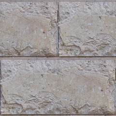 Seamless soft focus texture of decorative concrete wall from bricks.