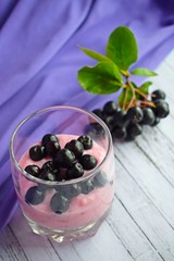 Ripe,fresh berries.Delicious dessert in a glass Cup on the table.