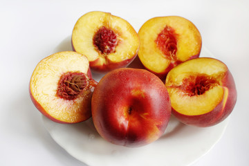 Naklejka na ściany i meble Ripe peach/.nectarine fruits isolated on white background