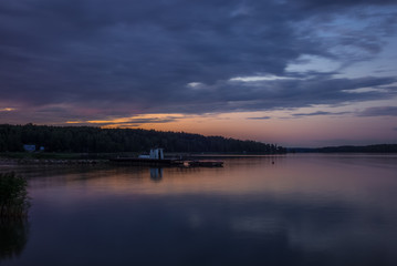 A traditional lifeguard and changing dress shelter on a wooden pier near the town of Porvoo in Finland at sunset in summer - 8