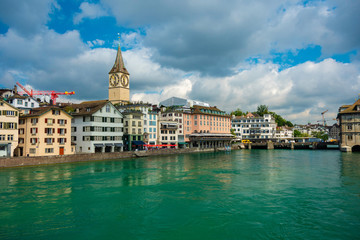View of historic Zurich city center and turquoise water river Limmat on a cloudly day in summer, Canton of Zurich, Switzerland