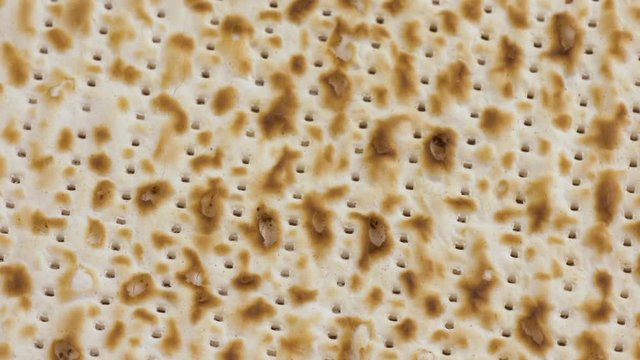 Closeup of rotating Passover Matzoh, Jewish Holiday Bread