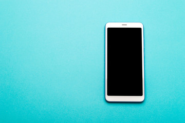 Smartphone with blank screen on colorful background with copy space. Modern and minimal style. Minimal concept.