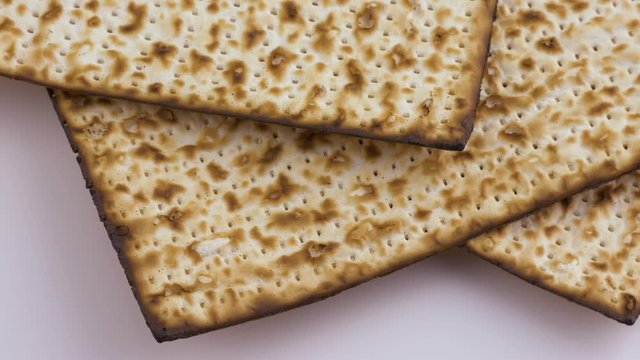 Slices of matzo. Fresh Easter bread made from wheat flour .