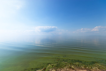 haze standing over water / bright day landscape