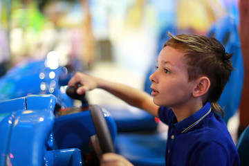 Boy playing car simulator