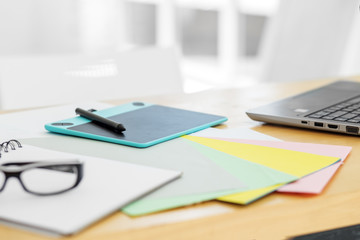 Graphics tablet on the desktop. Free space for text. Office workplace.