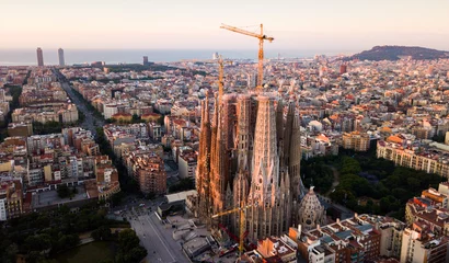Tuinposter Barcelona, Spain - June 13, 2019: Aerial panorama view of Barcelona city skyline and Sagrada familia at dusk time © JackF