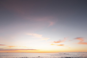 sun coming up over the sea