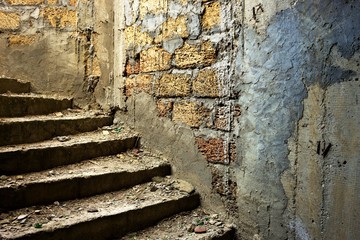 old dirty staircase in abandoned building closeup.
