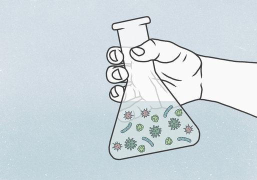 Detail of hand holding a conical flask containing bacteria in liquid
