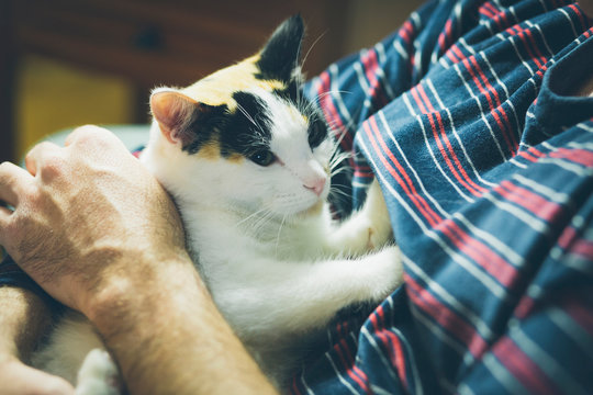 Man holding cat