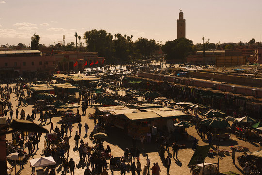 View of bustling souk market in Djemaa El Fna Square, Marrakesh, Morocco