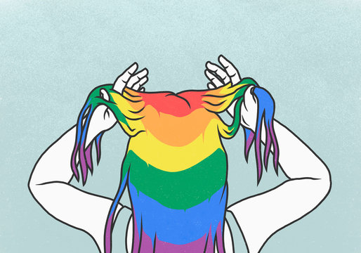 Woman with hands in rainbow hair