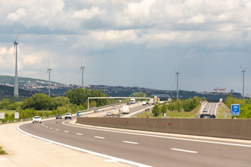 Fototapeta premium Roads Of Austria. View of Bratislava from Austria. Windmills along the road. Austria, may 2019/