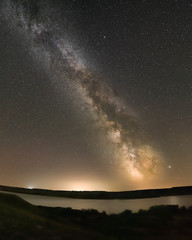 Fototapeta premium The Milky Way above Lake Diefenbaker at the Sask Landing in Saskatchewan, Canada