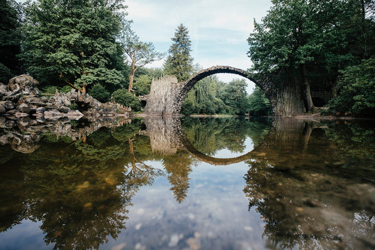 Tranquil Rakotzbruecke Devils Bridge, Rakotzbruecke, Brandenburg, Germany