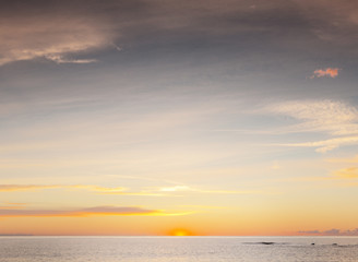 sun coming up over the sea