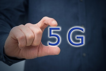 hand with 5g symbol or concept