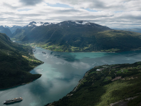 Scenic view idyllic green cliffs and fjord, Olden, Norway