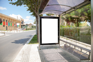 advertising board on asphalt roadadvertising board at bus stop on asphalt road