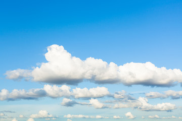 chains of white and gray clouds in sky in evening