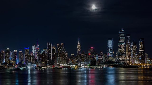 Midtown Manhattan Skyline New York City and Moon at Night Timelapse