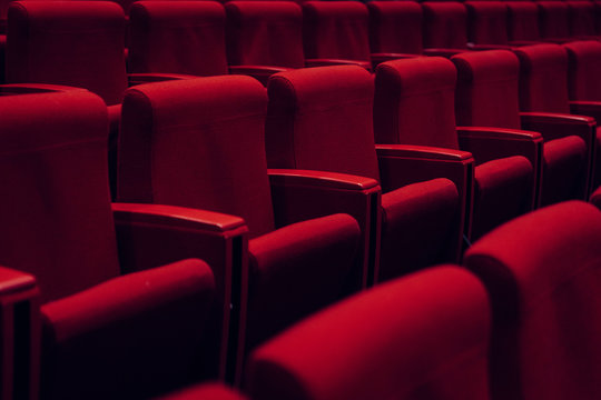 Red theater seats in a row