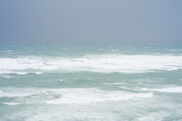 Beautiful wave on the beach. Early morning and strong wind. Sea pier large waves.