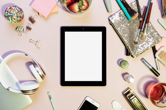 View form above digital tablet surrounded by personal belongings