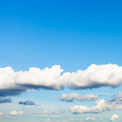 low white clouds in blue sky in summer twilight