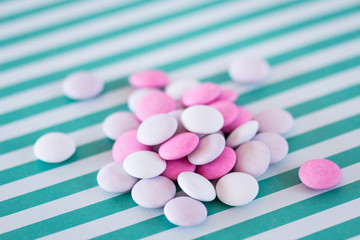 white and pink candies on stripes