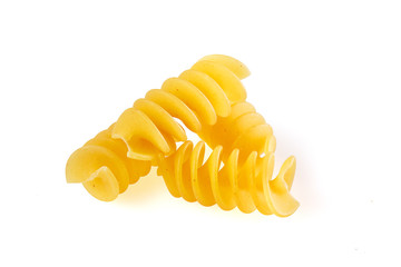 Naklejka premium Dried corkscrew shaped pasta or fusilli pasta over white background