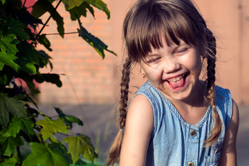 Little Muddy girl. Little naughty girl face smeared in chocolate