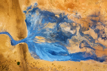 Naklejka premium Aerial view on the Iceland. Aerial landscape above river in the geysers valley. Icelandic landscape from air. Famous place. Travel - image