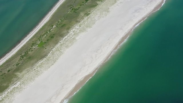 The nutrient-rich waters of the Atlantic Ocean bathe a scenic beach on Cape Cod, Massachusetts. This beautiful area of New England, not too far from Boston, is a popular summer vacation destination.