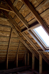 Wooden attic at home with window